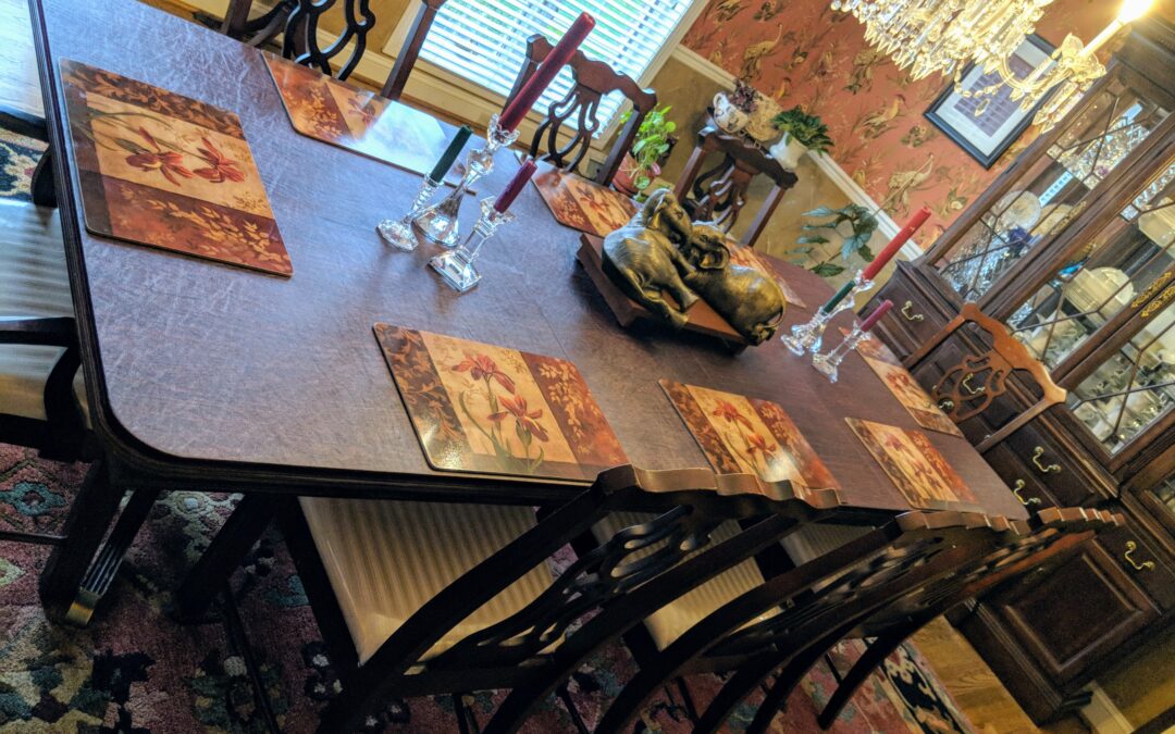 Fall themed placemats arranged on a custom table pad placed perfectly on a dining room table.
