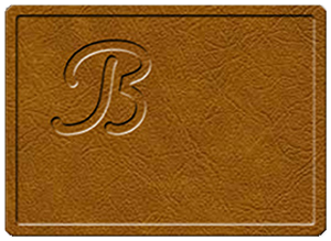 Top of a placemat pad with the letter B stamped into the upper left corner.